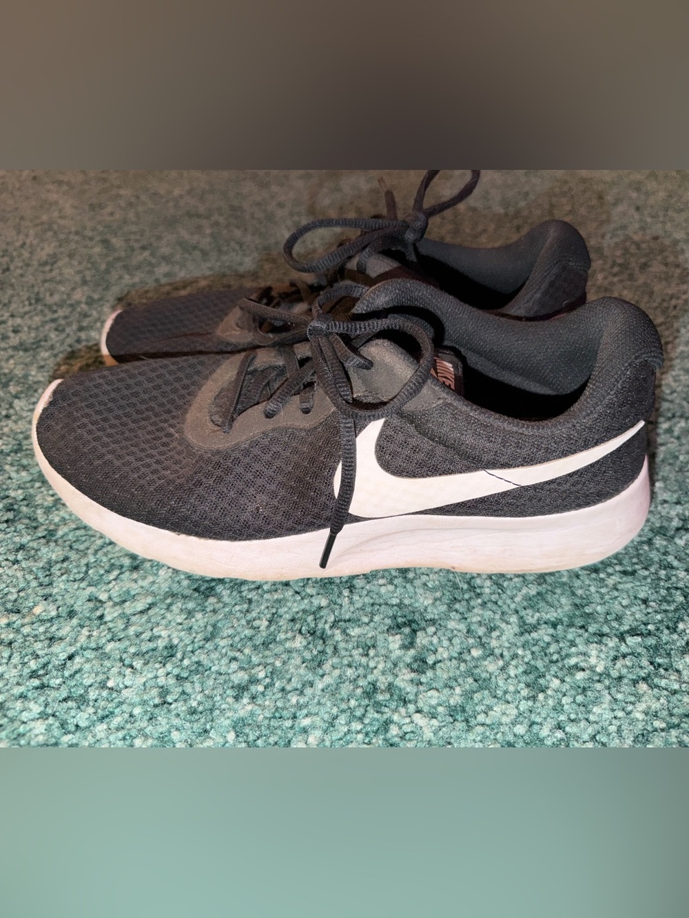 Nike women's Black Athletic Sneakers with White Swoosh